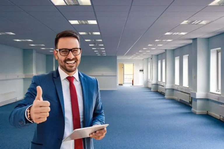 happy business man giving thumbs up