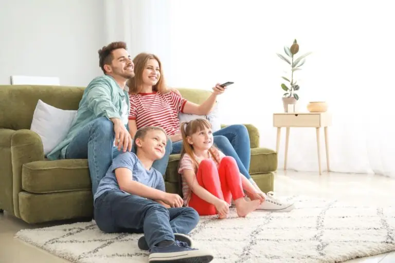 happy family watching tv at home